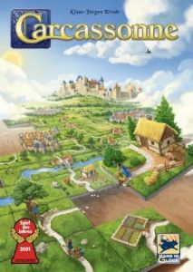 Carcassonne - box art. Graphic of a medieval city, with a castle, a thatched roof home, trees, and gardens.
