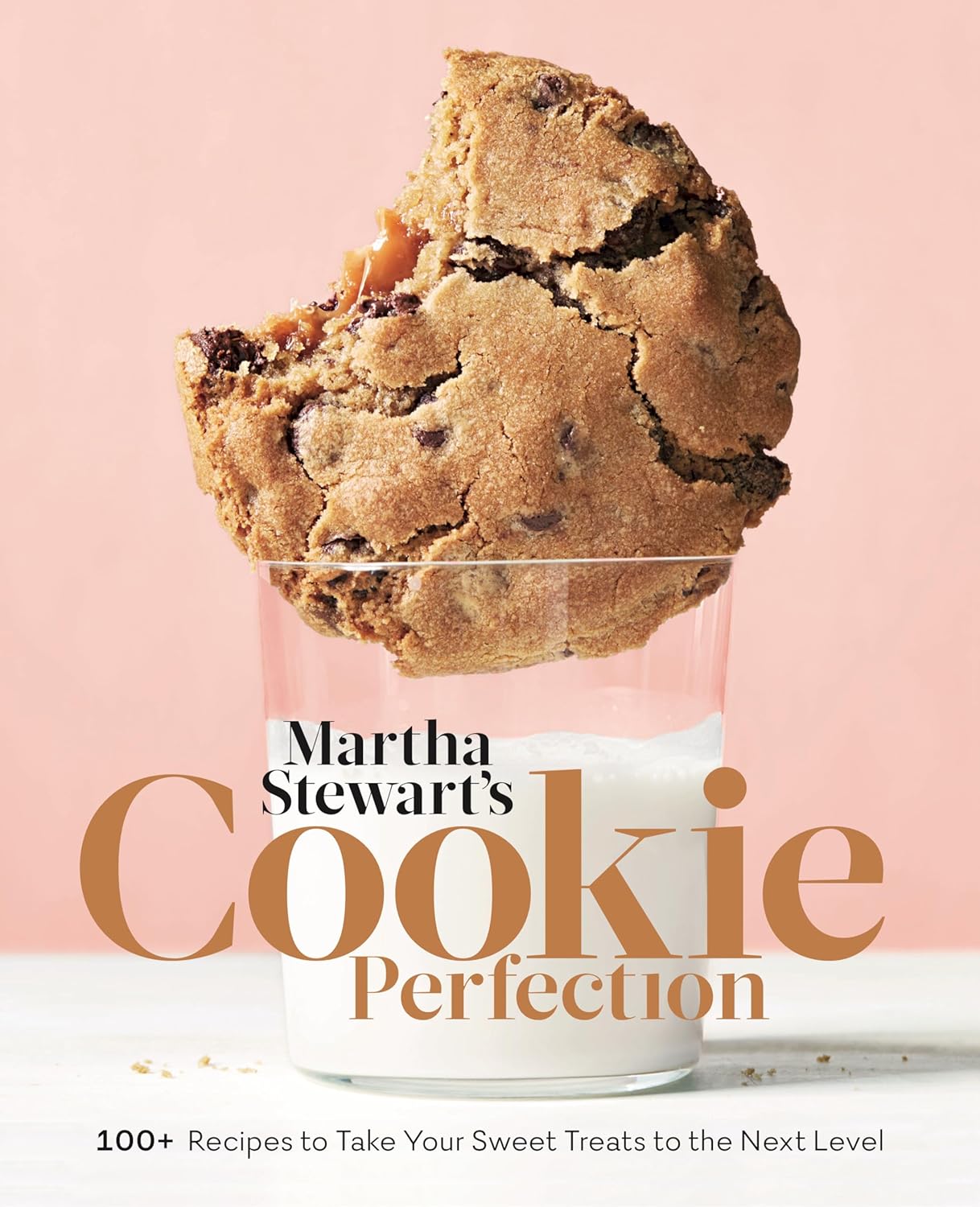 Cover of Martha Stewart's Cookie Perfection. A large photo of a cookie sitting halfway in a glass of milk.