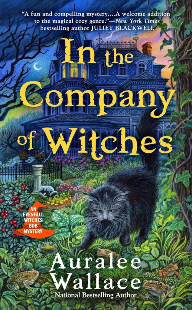 Cover of In the Company of Witches. The foreground is a black cat walking through an overgrown yard. In the background is a Victorian house, with a sunset and a crescent moon.