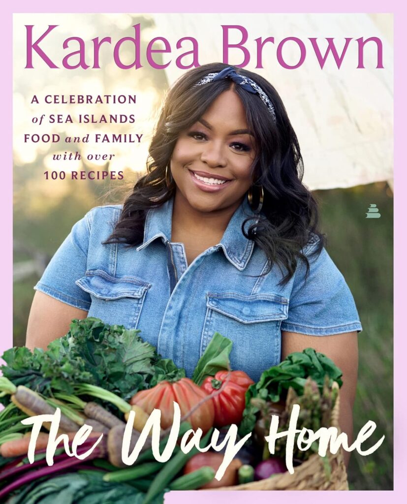 Cover of The Way Home. Photo of author Kardea Brown, wearing a denim short and holding a basket full of vegetables.