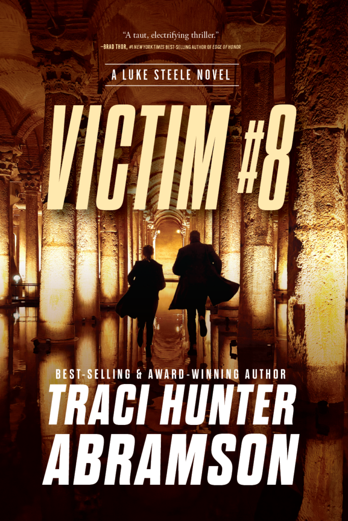 Cover of Victim #8. Two people run down a long corridor with columns on either side. They are silhouetted against the light coming in on either side of them, but there isn't much color where they are, only the stone columns and halls.