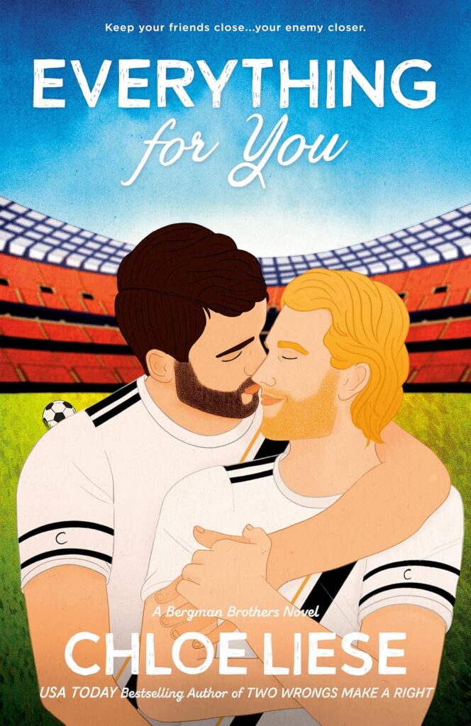 Cover of Everything For You. Two male soccer players are embracing and almost kissing. They are wearing jerseys and standing on a soccer field with stands behind them.