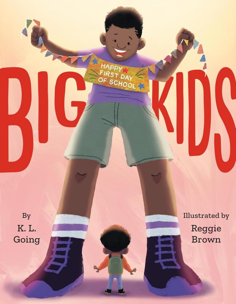 Cover of Big Kids. There is a giant kid holding a sign that says "Happy First Day of School." He is towering over a small boy, who is depicted as standing below his legs. The small boy is looking up at the tall boy and the big kid is smiling at his new friend.