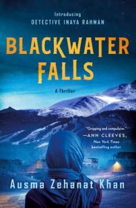 Cover of Blackwater Falls. Back of young woman in a hijab looking toward the mountains, with houses in front of her.