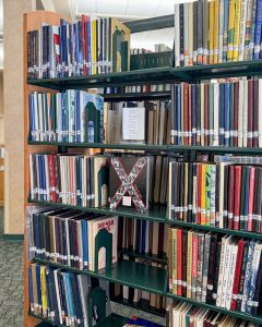 Picture of a yearbook on a shelve.