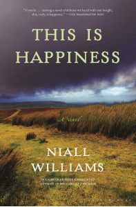 Cover of This Is Happiness. Photo of a stormy sky over a plain. There are low hills in the background, waving grasses in the foreground, and a clearing closest to the viewer on the cover. The sky looks like it is clearing in the distance.