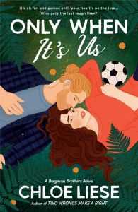 Cover of Only When It's Us. The couple is lying on a field with ferns around them. There's a soccer ball lying beside them, too.