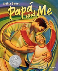 Cover of Papa and Me. Father and son, with father with his arm around his son. There are swirled colors behind the people.
